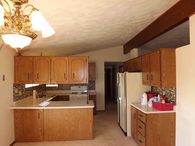 2760 North 3350th Road Marseilles, IL 61341 - Photo 4 of 24 a kitchen that has a cabinets and a stove