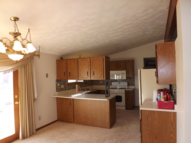 2760 North 3350th Road Marseilles, IL 61341 - Photo 5 of 24 a kitchen with stainless steel appliances granite countertop a refrigerator sink and stove