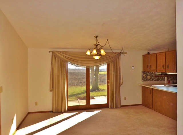 2760 North 3350th Road Marseilles, IL 61341 - Photo 6 of 24 a view of a kitchen with a sink and cabinet area