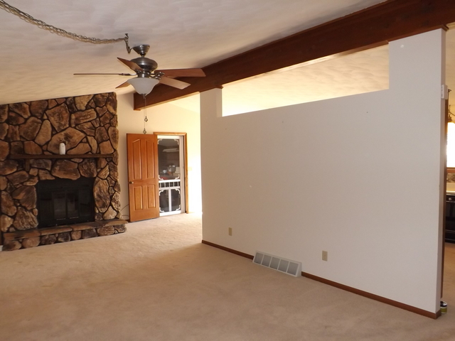 2760 North 3350th Road Marseilles, IL 61341 - Photo 8 of 24 a view of a livingroom with a fireplace and a window