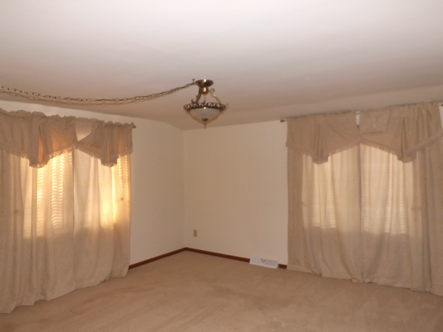 2760 North 3350th Road Marseilles, IL 61341 - Photo 10 of 24 a view of a livingroom with an empty space and a window