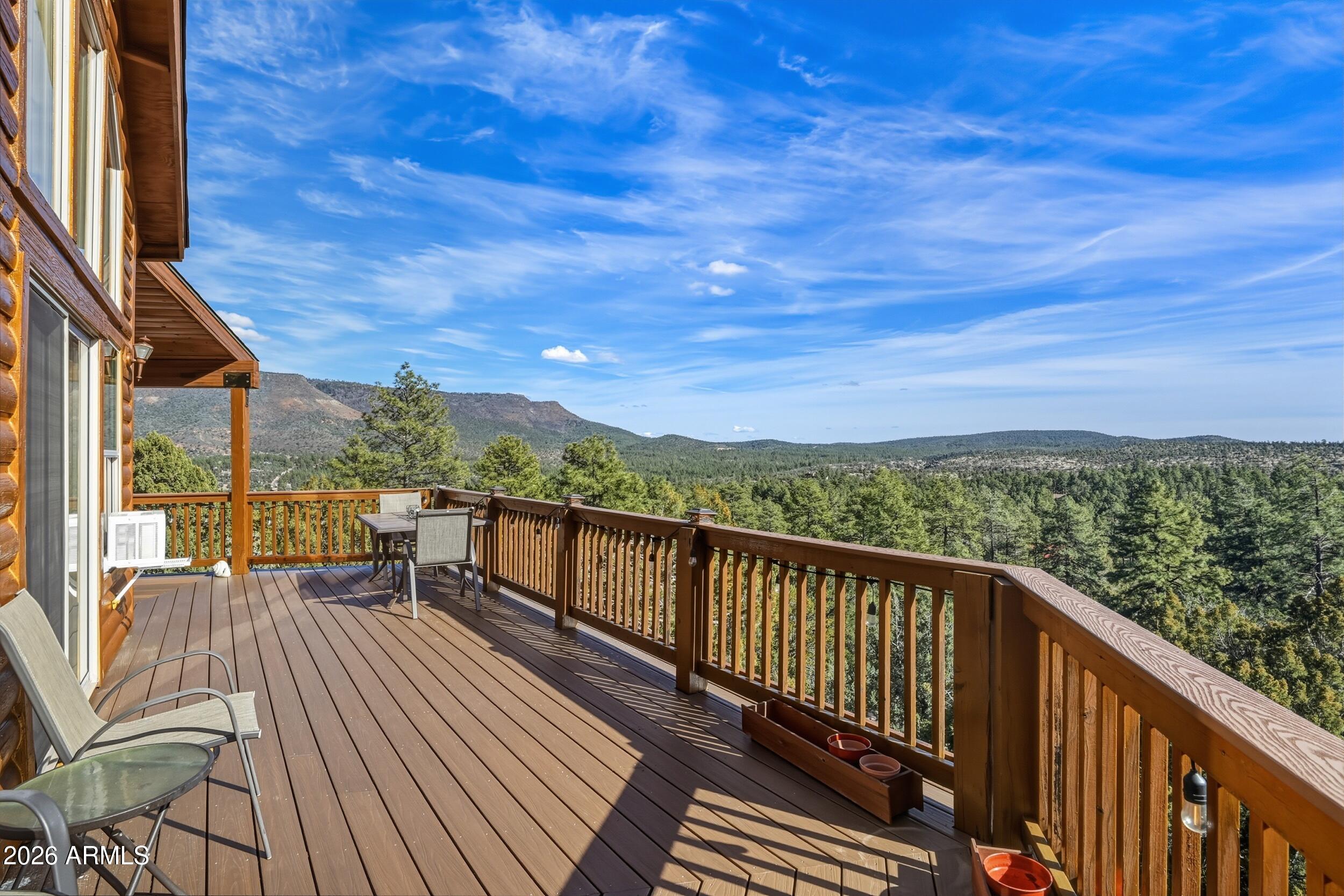 3119 Kysar Way Pine, AZ 85544 - Photo 35 of 68 a view of a balcony with wooden floor and iron stairs