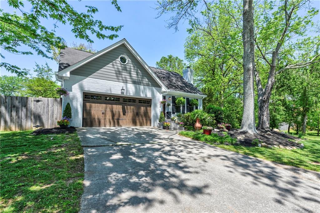 3144 Caintal Court Decatur, GA 30033 - Photo 1 of 1 a view of a house with a yard and large trees