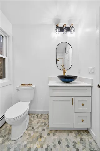 a bathroom with a toilet and a sink