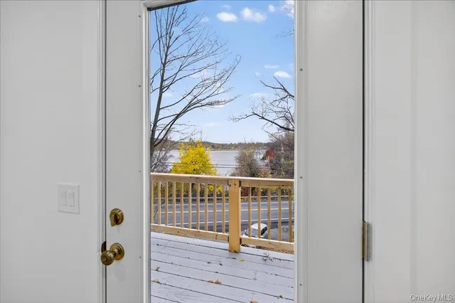 a view of balcony with wooden floor
