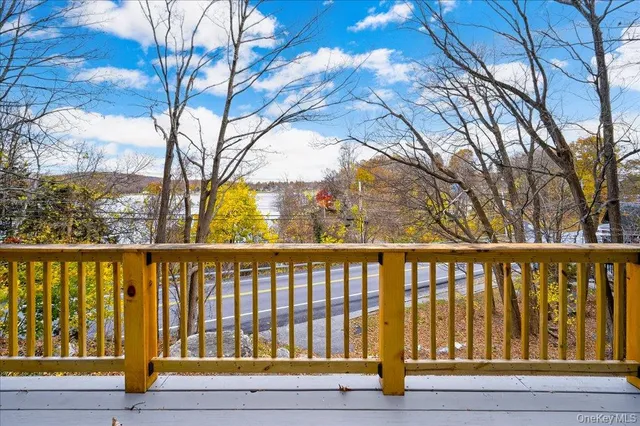 a view of balcony with wooden floor