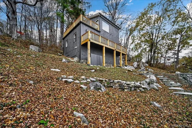a picture of a bench in front of a wall