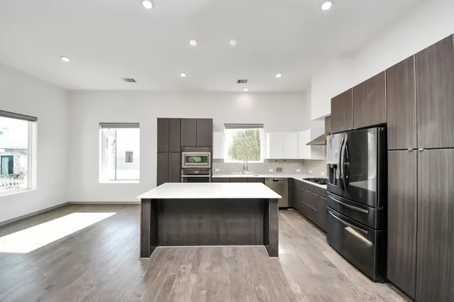 a kitchen with counter top space cabinets and stainless steel appliances