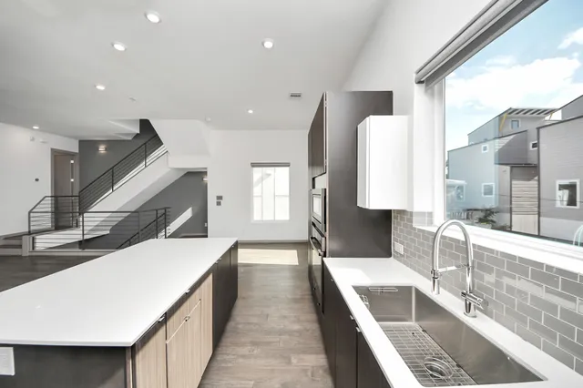 a very nice looking kitchen with a large window