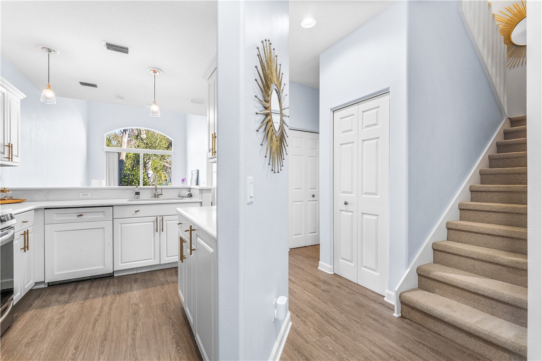 909 Bahia Mar Road Vero Beach, FL 32963 - Photo 15 of 36 a kitchen with white cabinets and sink