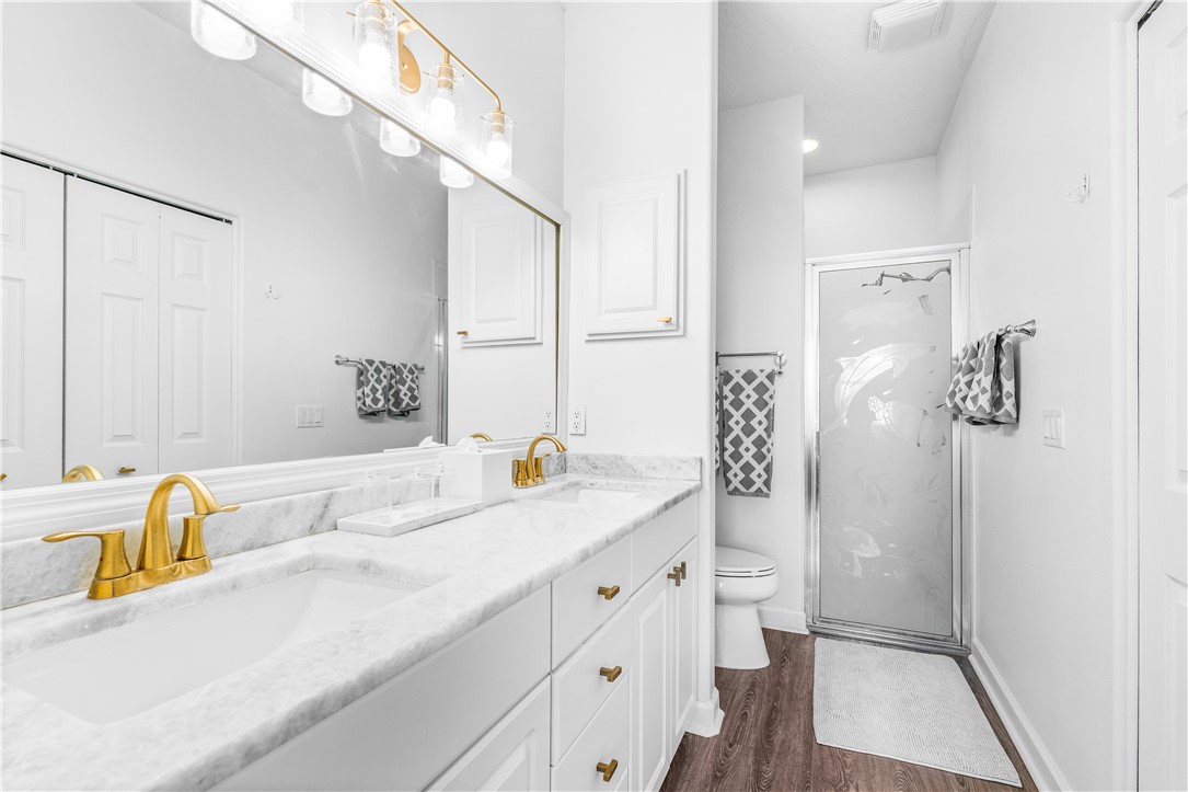 909 Bahia Mar Road Vero Beach, FL 32963 - Photo 24 of 36 a bathroom with a granite countertop sink and a mirror
