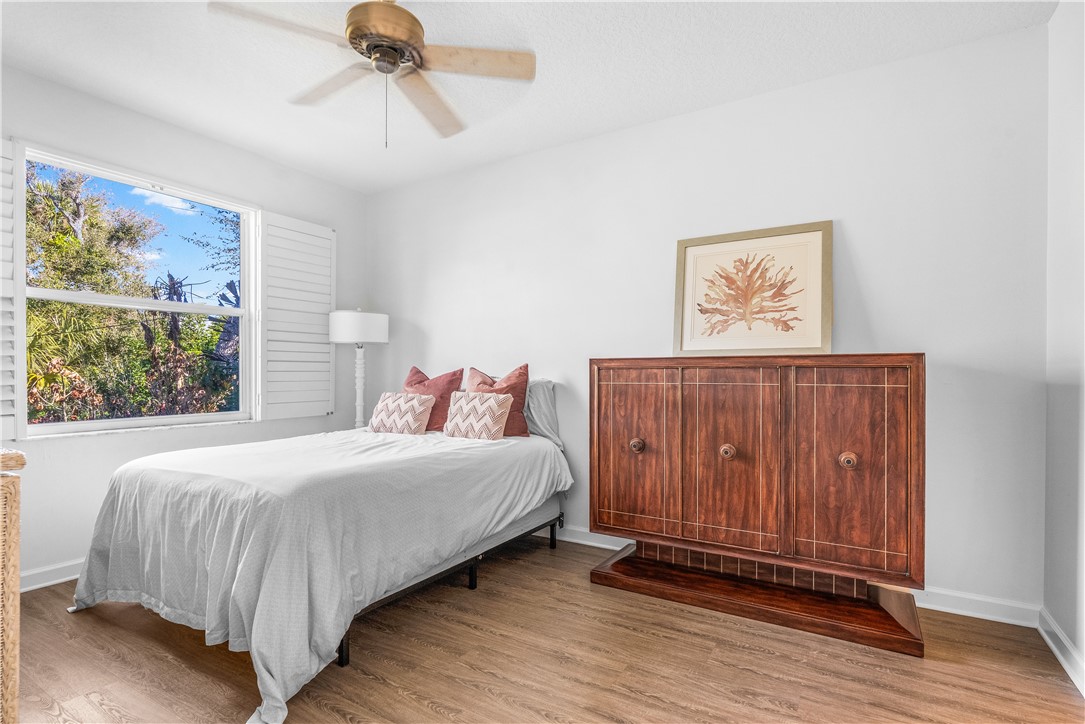 909 Bahia Mar Road Vero Beach, FL 32963 - Photo 25 of 36 a bedroom with a bed and a painting on the wall