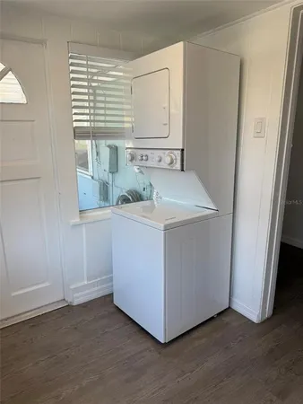 a view of a backyard with furniture