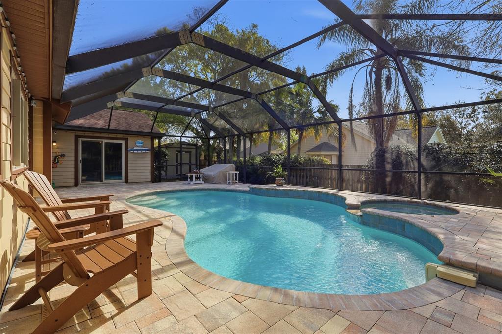 3488 Ridge Boulevard Palm Harbor, FL 34684 - Photo 28 of 30 a view of a swimming pool with a patio