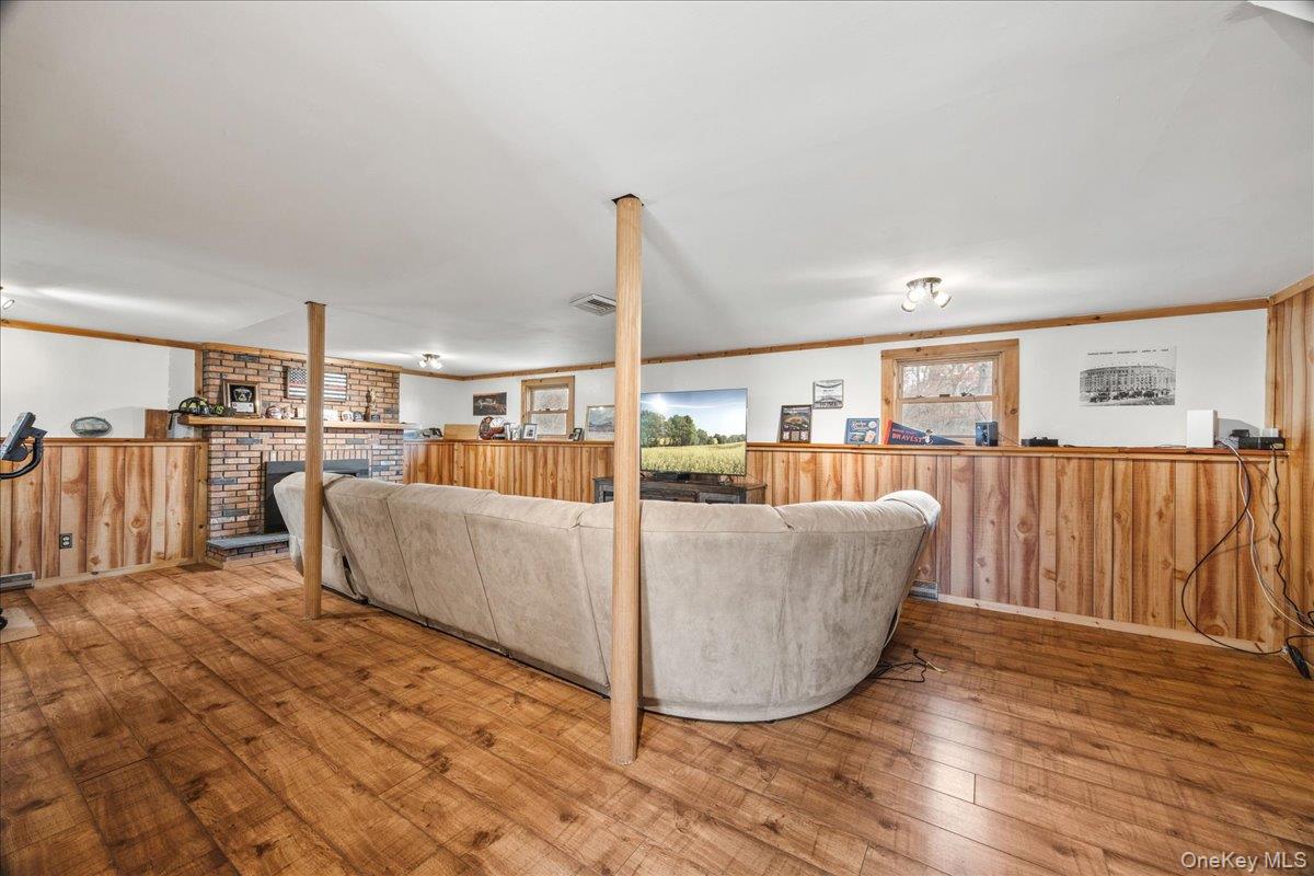 155 Mill Street Wallkill, NY 12589 - Photo 17 of 26 a living room with furniture and a floor to ceiling window