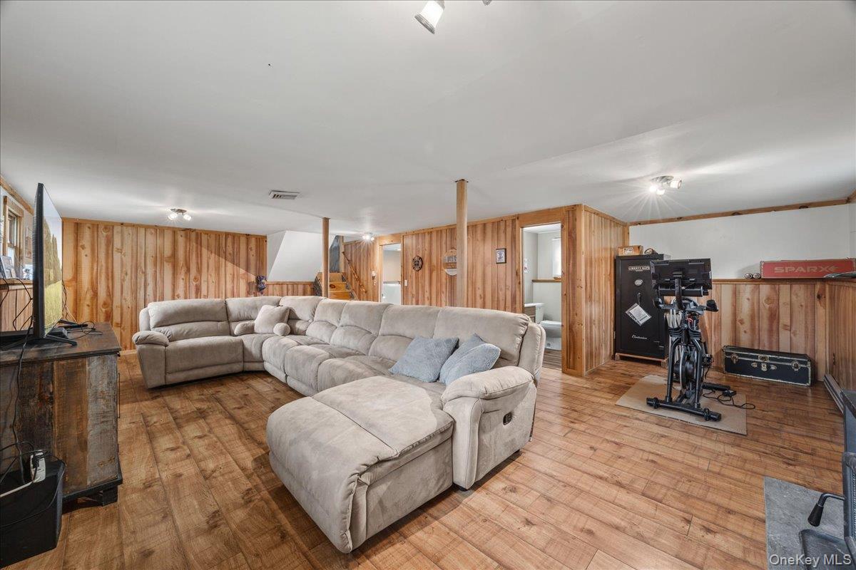 155 Mill Street Wallkill, NY 12589 - Photo 18 of 26 a living room with furniture and a flat screen tv