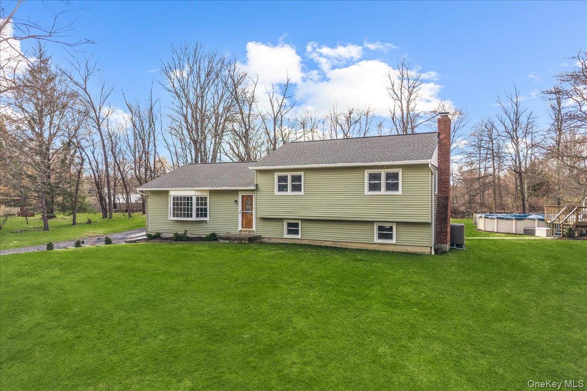 155 Mill Street Wallkill, NY 12589 - Photo 2 of 26 a front view of a house with a garden