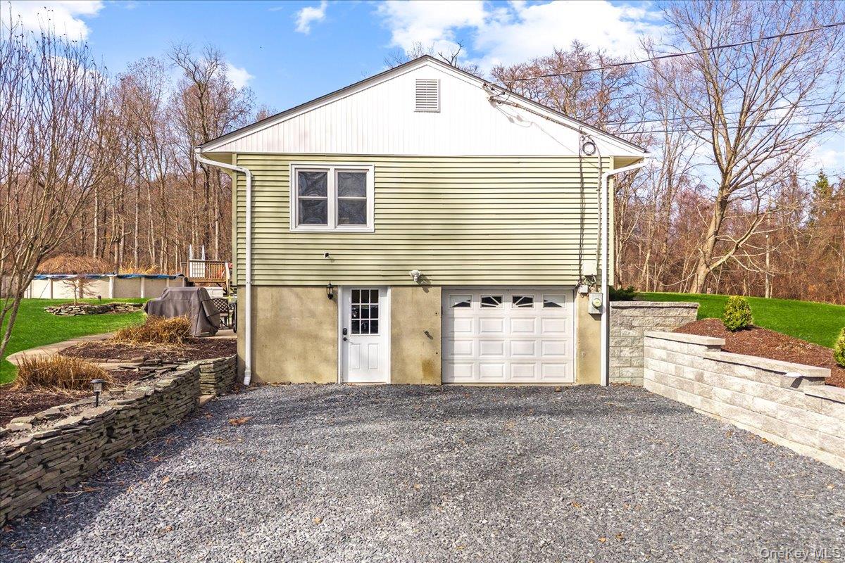 155 Mill Street Wallkill, NY 12589 - Photo 22 of 26 a view of a house with a yard and garage