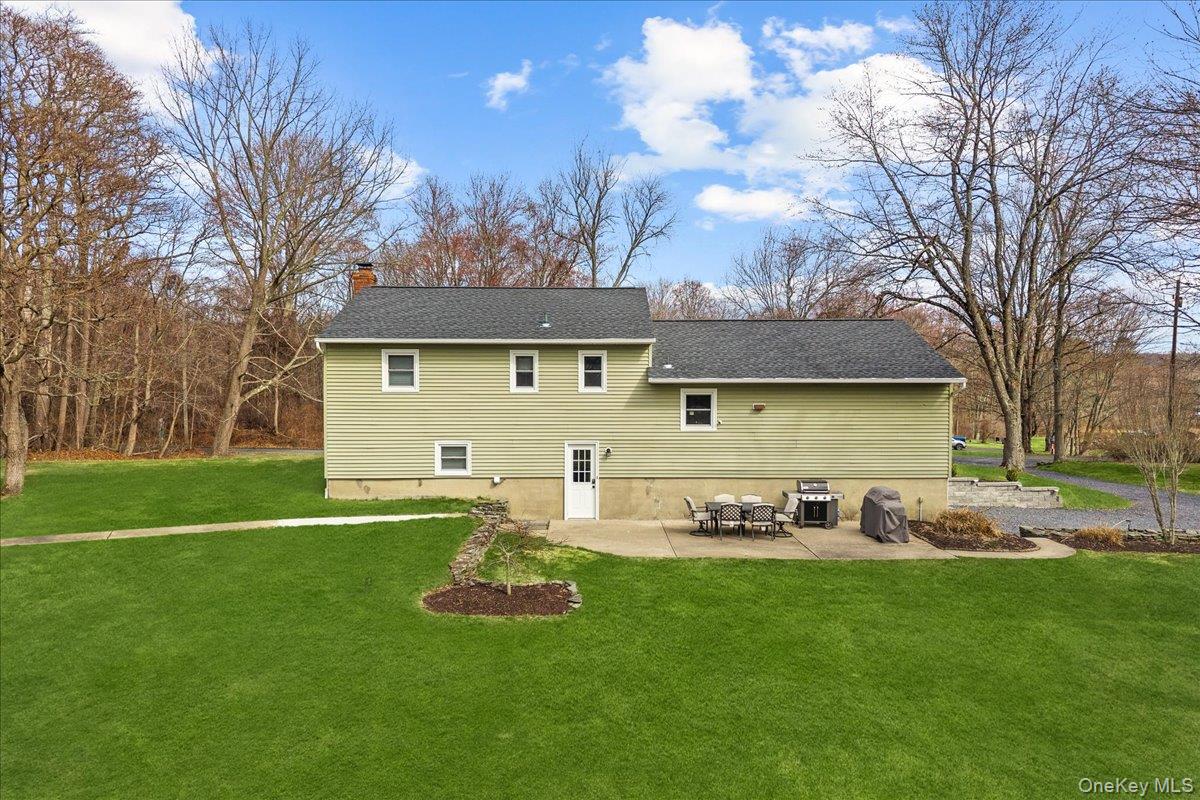 155 Mill Street Wallkill, NY 12589 - Photo 23 of 26 a front view of house with yard and seating area