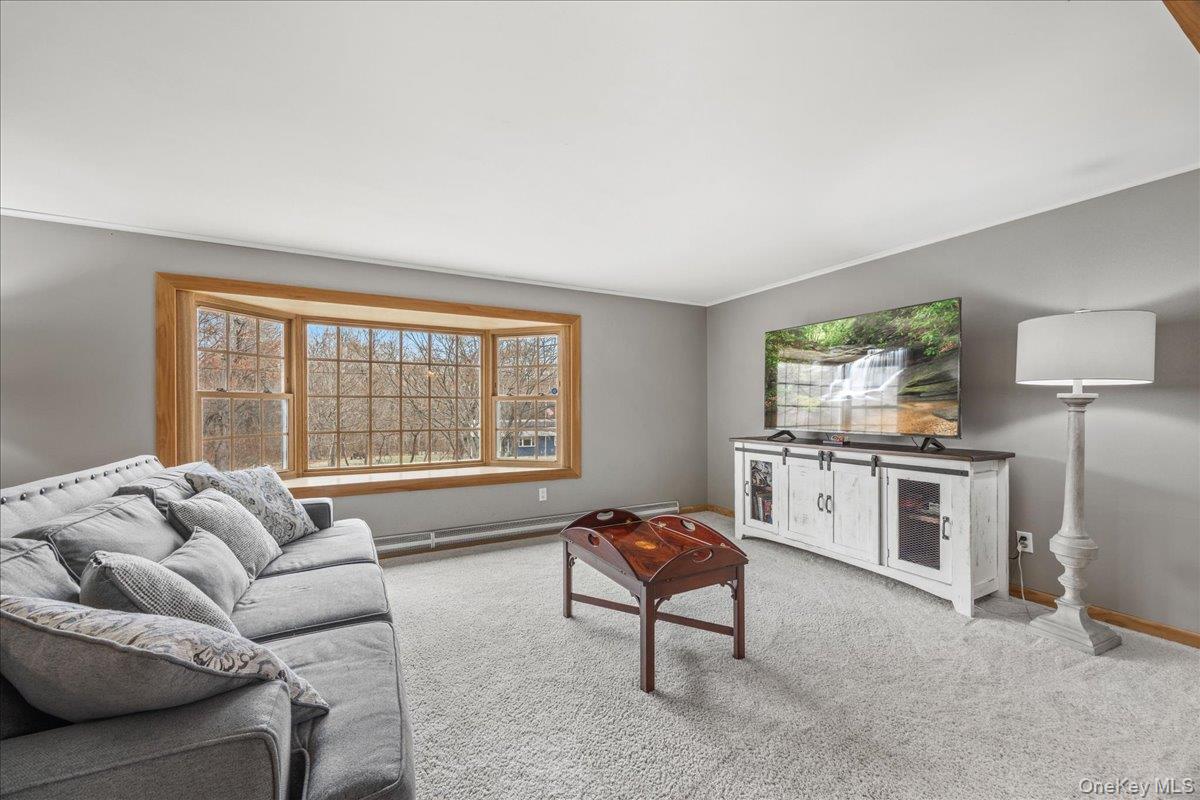 155 Mill Street Wallkill, NY 12589 - Photo 3 of 26 a living room with furniture and a large window