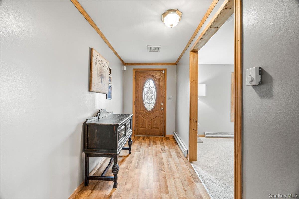 155 Mill Street Wallkill, NY 12589 - Photo 4 of 26 a living room with furniture a window and a mirror