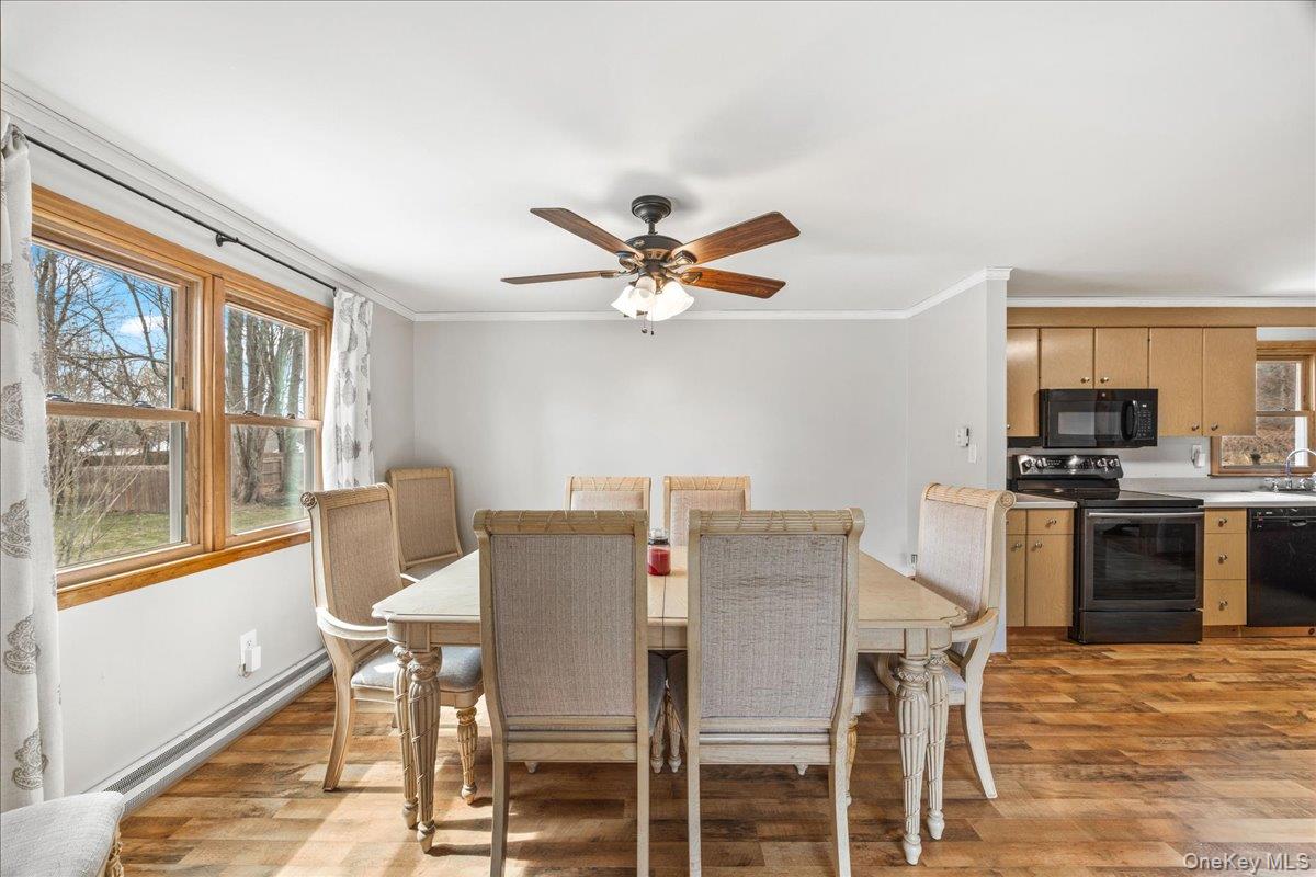 155 Mill Street Wallkill, NY 12589 - Photo 5 of 26 a view of a dining room with furniture window and wooden floor