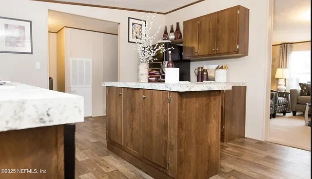 a kitchen with stainless steel appliances a sink stove and refrigerator