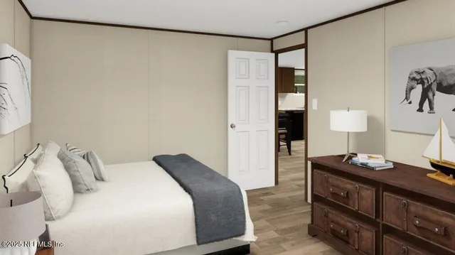 a kitchen with a table chairs refrigerator and cabinets