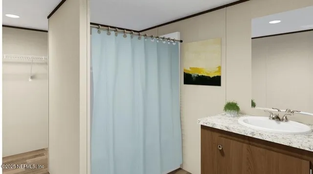 a bedroom with a bed and a night stand