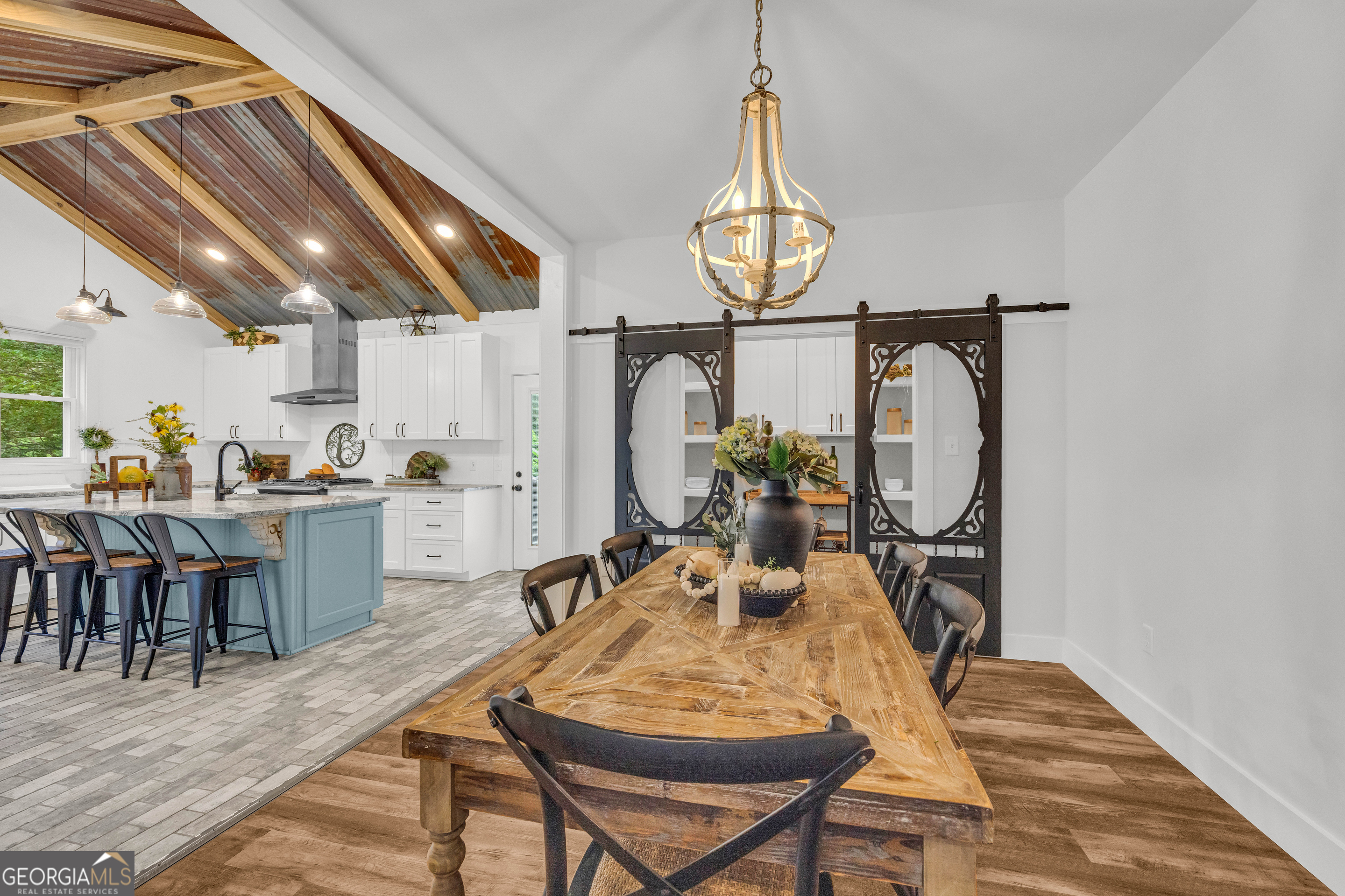 599 Double Branch Road Danielsville, GA 30633 - Photo 12 of 158 a view of a dining room with furniture and chandelier