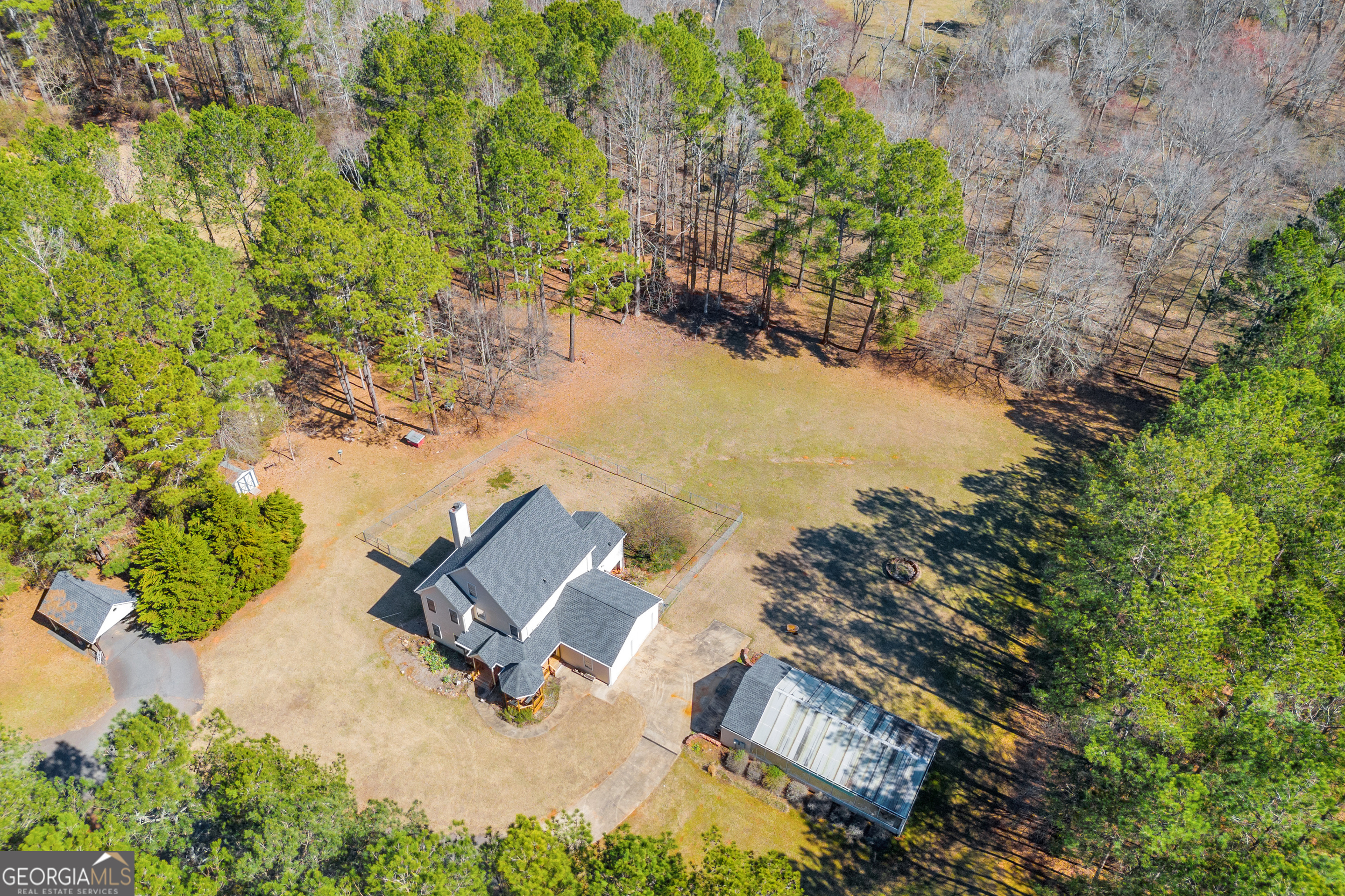 599 Double Branch Road Danielsville, GA 30633 - Photo 121 of 158 an aerial view of a house with a yard and lake view