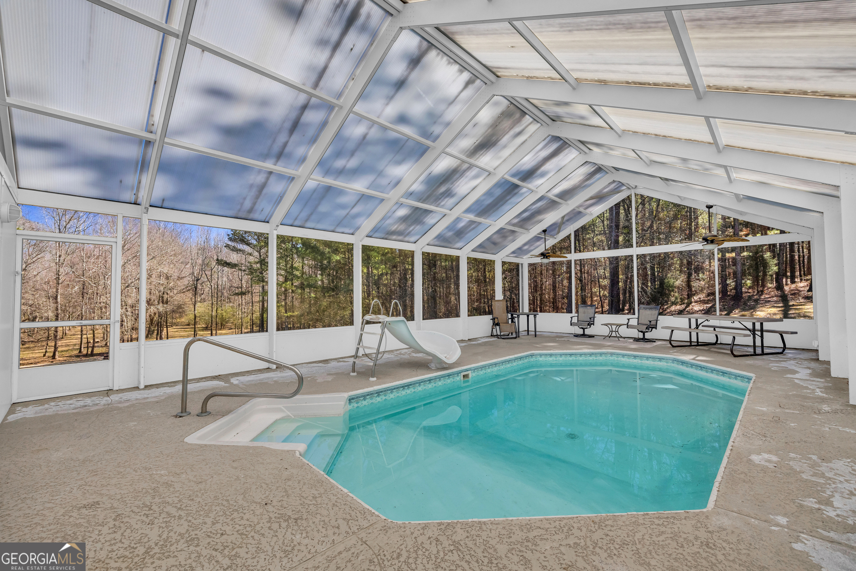599 Double Branch Road Danielsville, GA 30633 - Photo 122 of 158 a view of a swimming pool with a patio