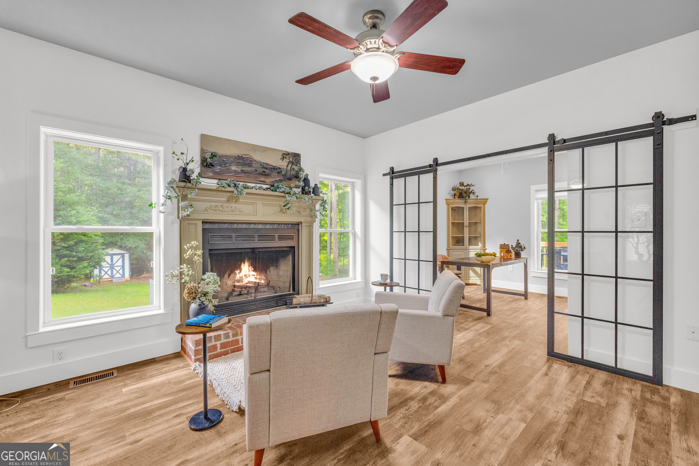 599 Double Branch Road Danielsville, GA 30633 - Photo 136 of 158 a living room with furniture and a fireplace