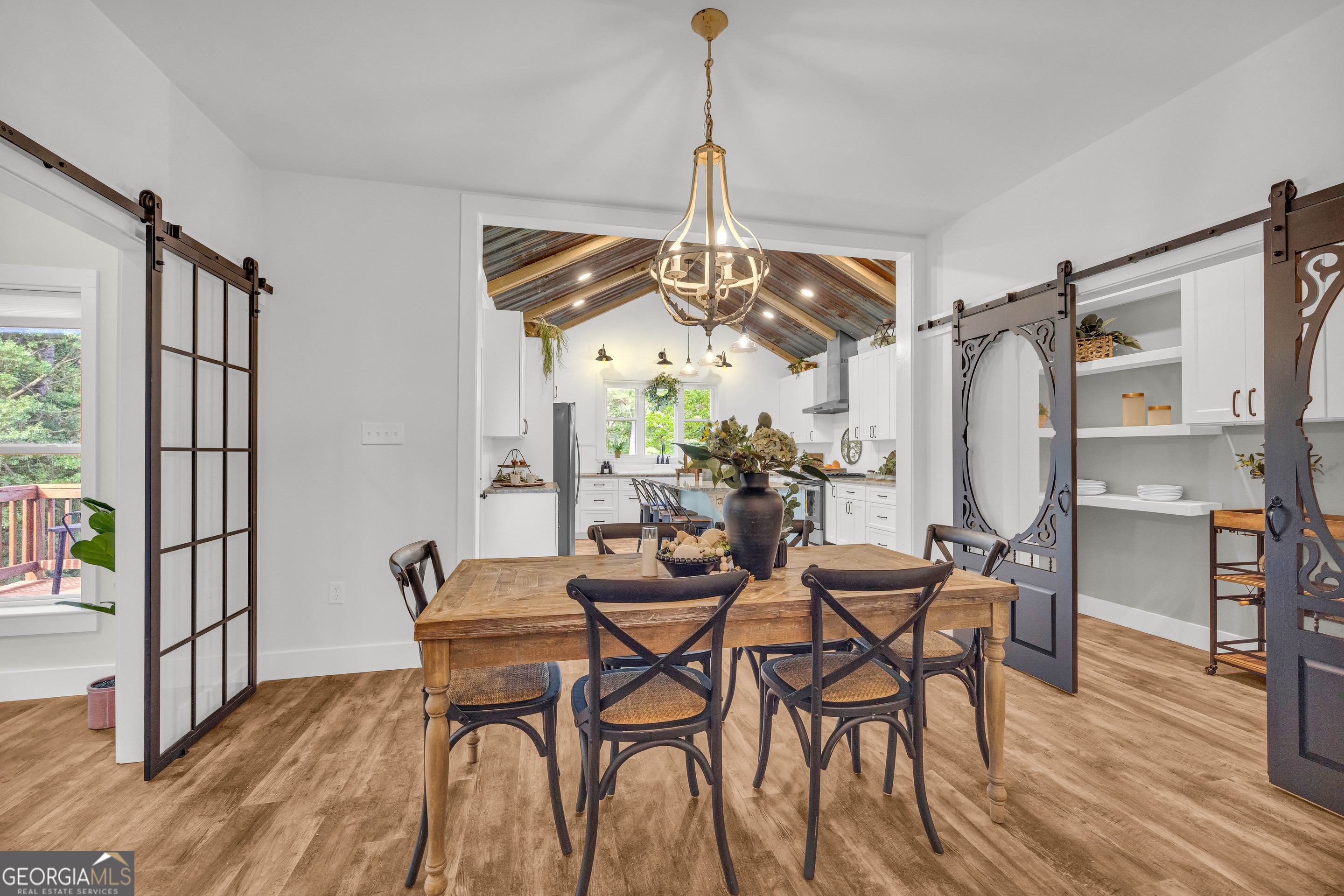 599 Double Branch Road Danielsville, GA 30633 - Photo 14 of 158 a view of a dining room with furniture and wooden floor