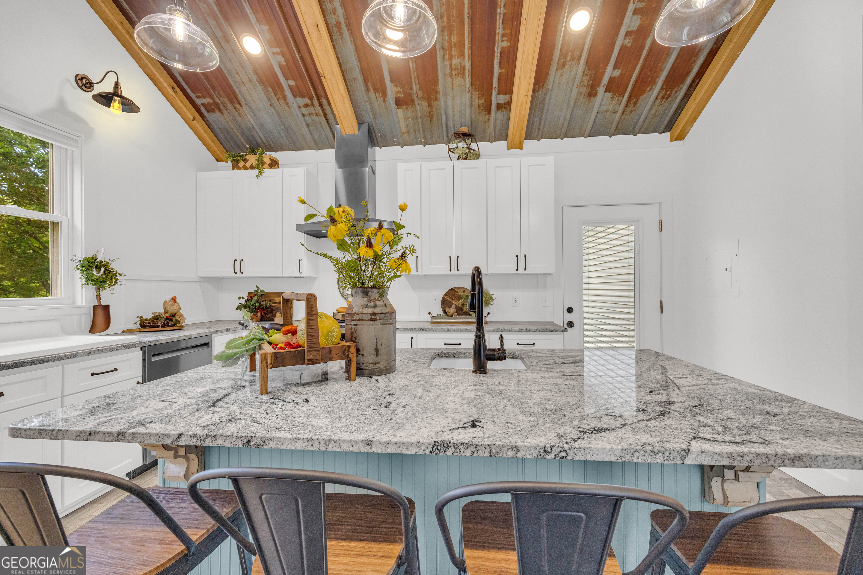 599 Double Branch Road Danielsville, GA 30633 - Photo 158 of 158 a kitchen with granite countertop a sink and a white wooden cabinets