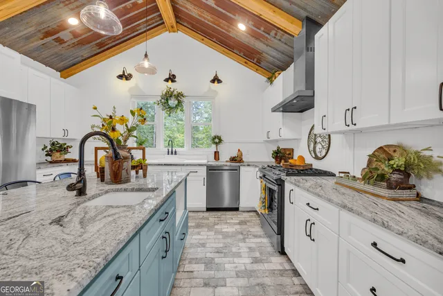 a view of a staircase with wooden floor and white walls