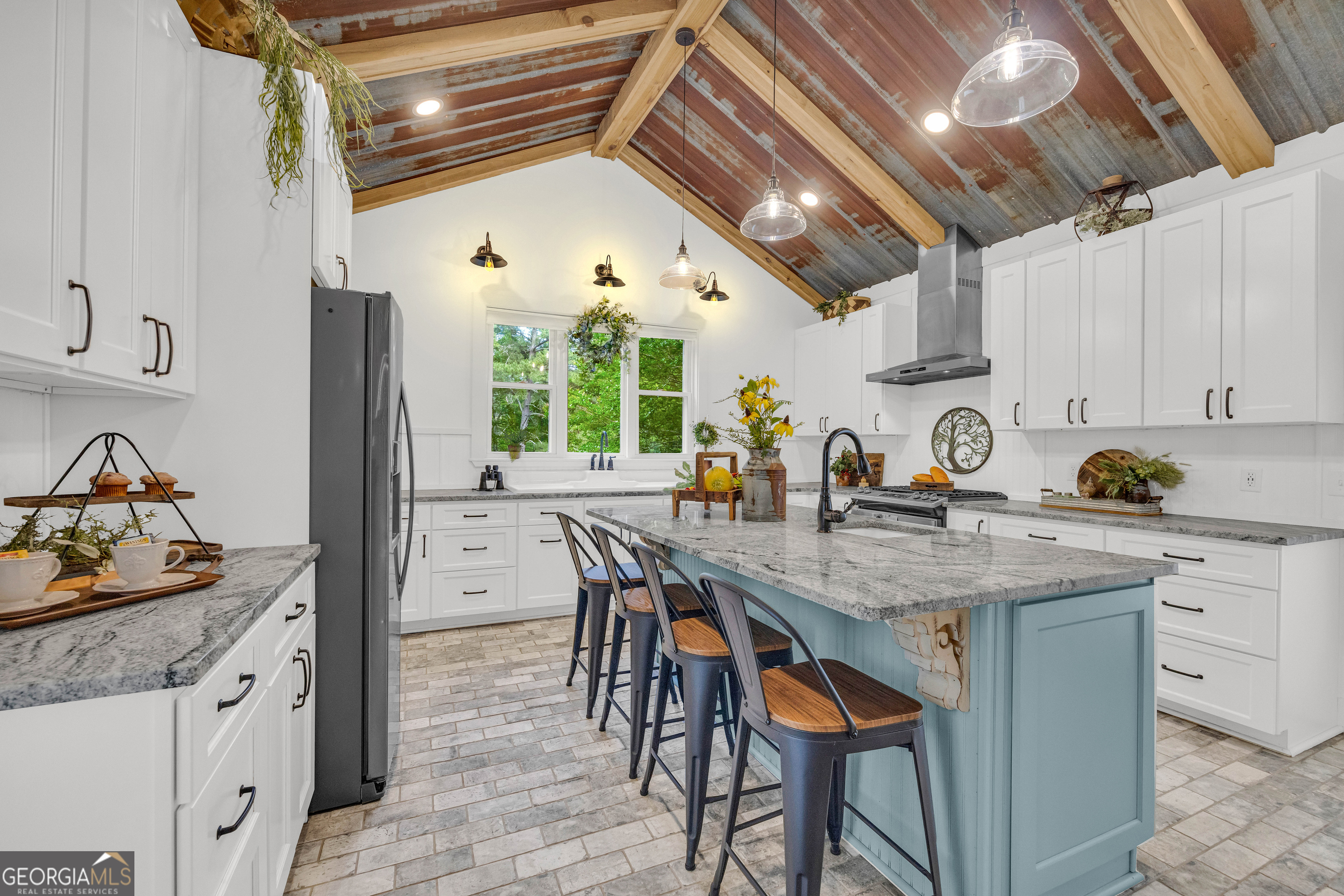 599 Double Branch Road Danielsville, GA 30633 - Photo 21 of 158 a kitchen with stainless steel appliances granite countertop a stove a sink dishwasher and cabinets with wooden floor