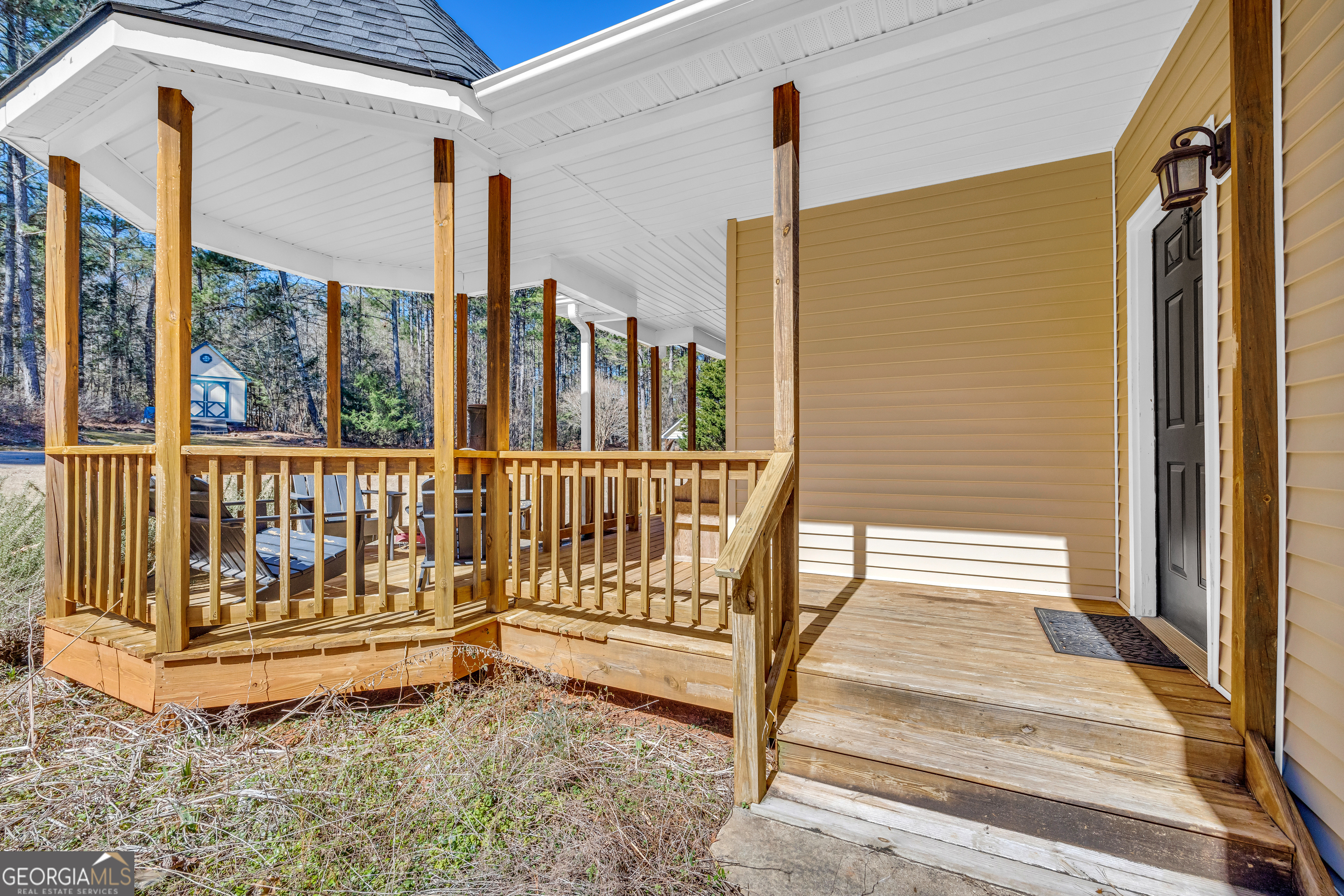 599 Double Branch Road Danielsville, GA 30633 - Photo 29 of 158 a view of a porch with wooden floor