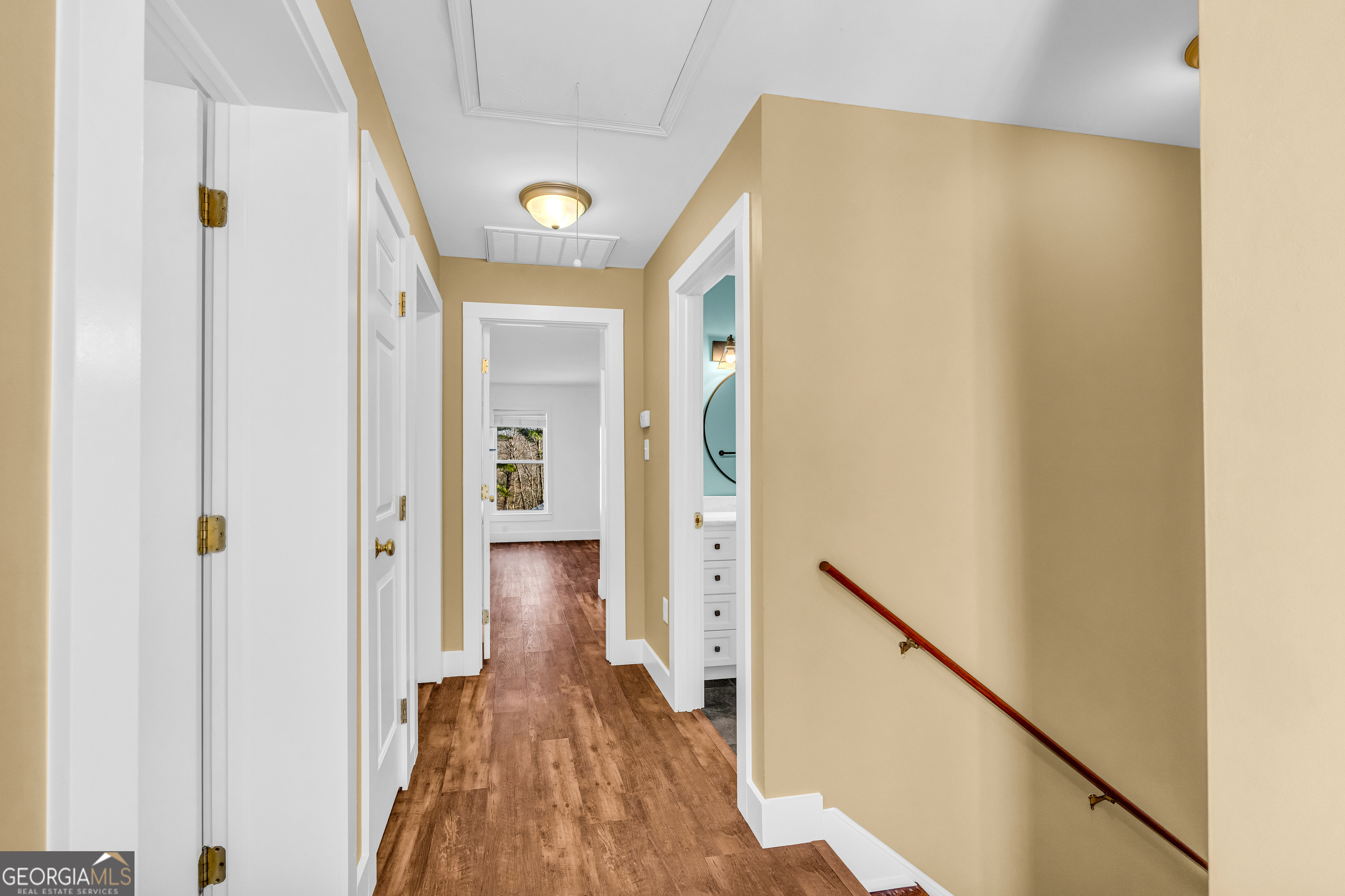599 Double Branch Road Danielsville, GA 30633 - Photo 37 of 158 a view of a hallway with wooden floor and staircase