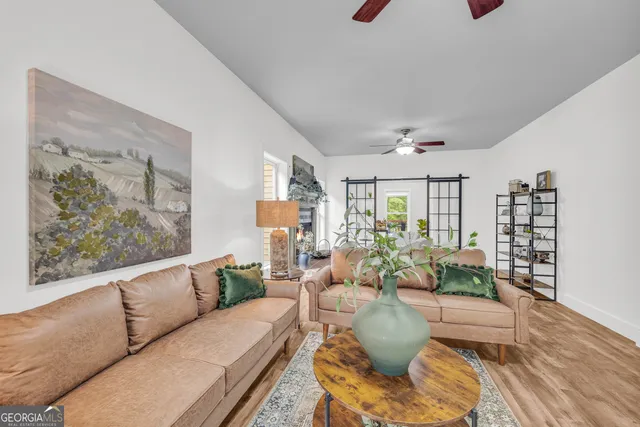 a living room with furniture and a window