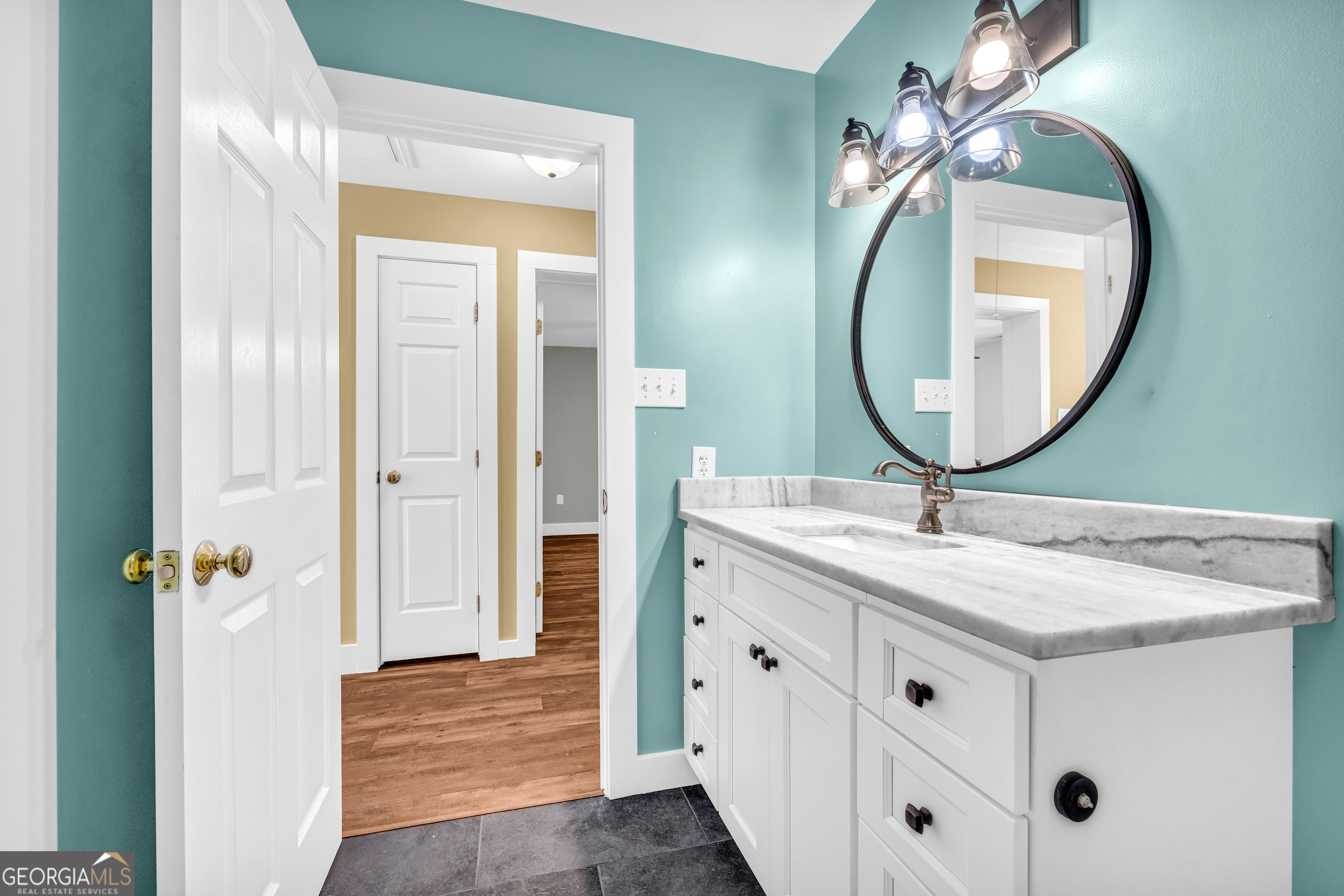 599 Double Branch Road Danielsville, GA 30633 - Photo 41 of 158 a bathroom with a sink vanity and a mirror