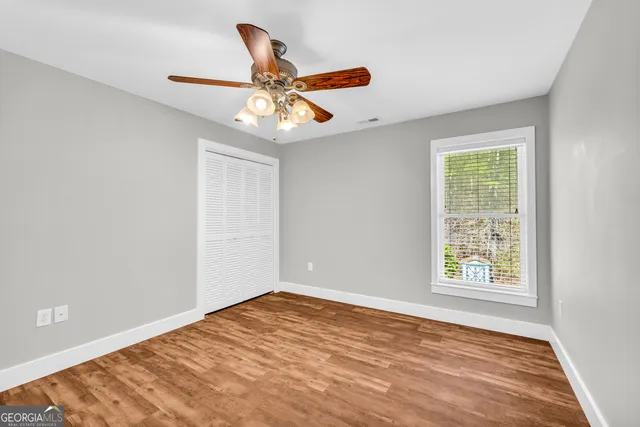 a living room with furniture a fireplace and a potted plant