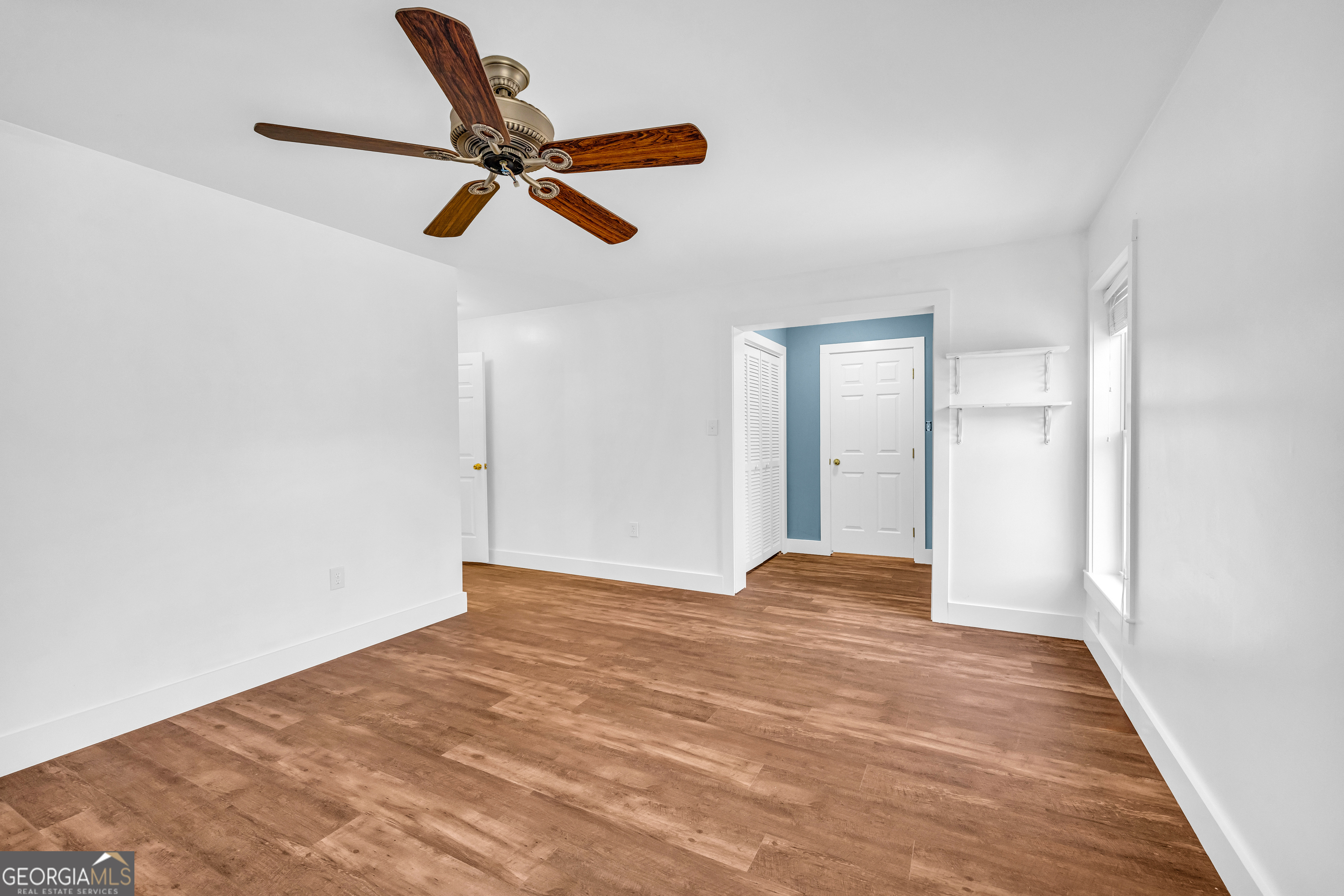 599 Double Branch Road Danielsville, GA 30633 - Photo 49 of 158 a view of empty room with wooden floor