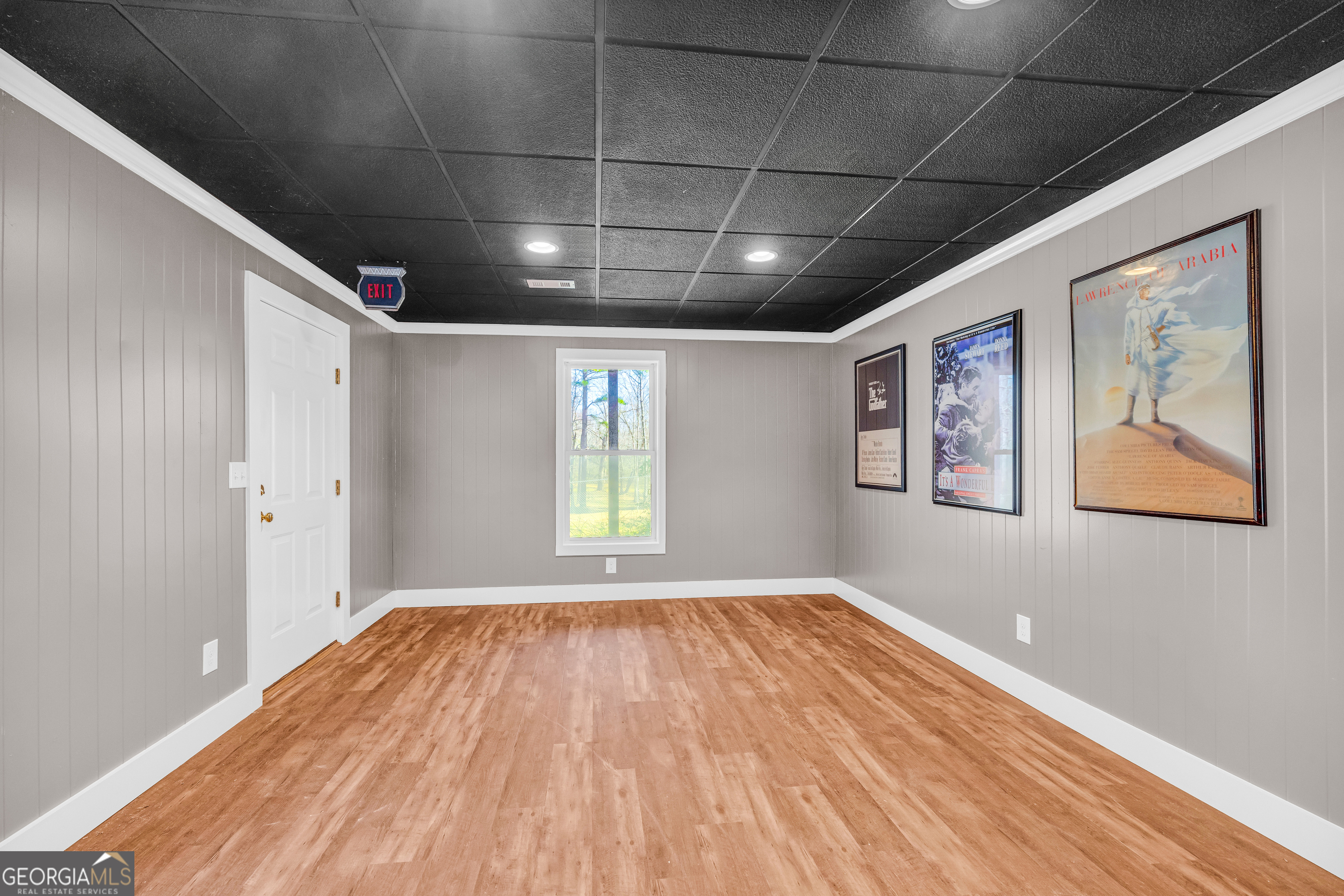 599 Double Branch Road Danielsville, GA 30633 - Photo 56 of 158 a view of empty room with wooden floor and fan