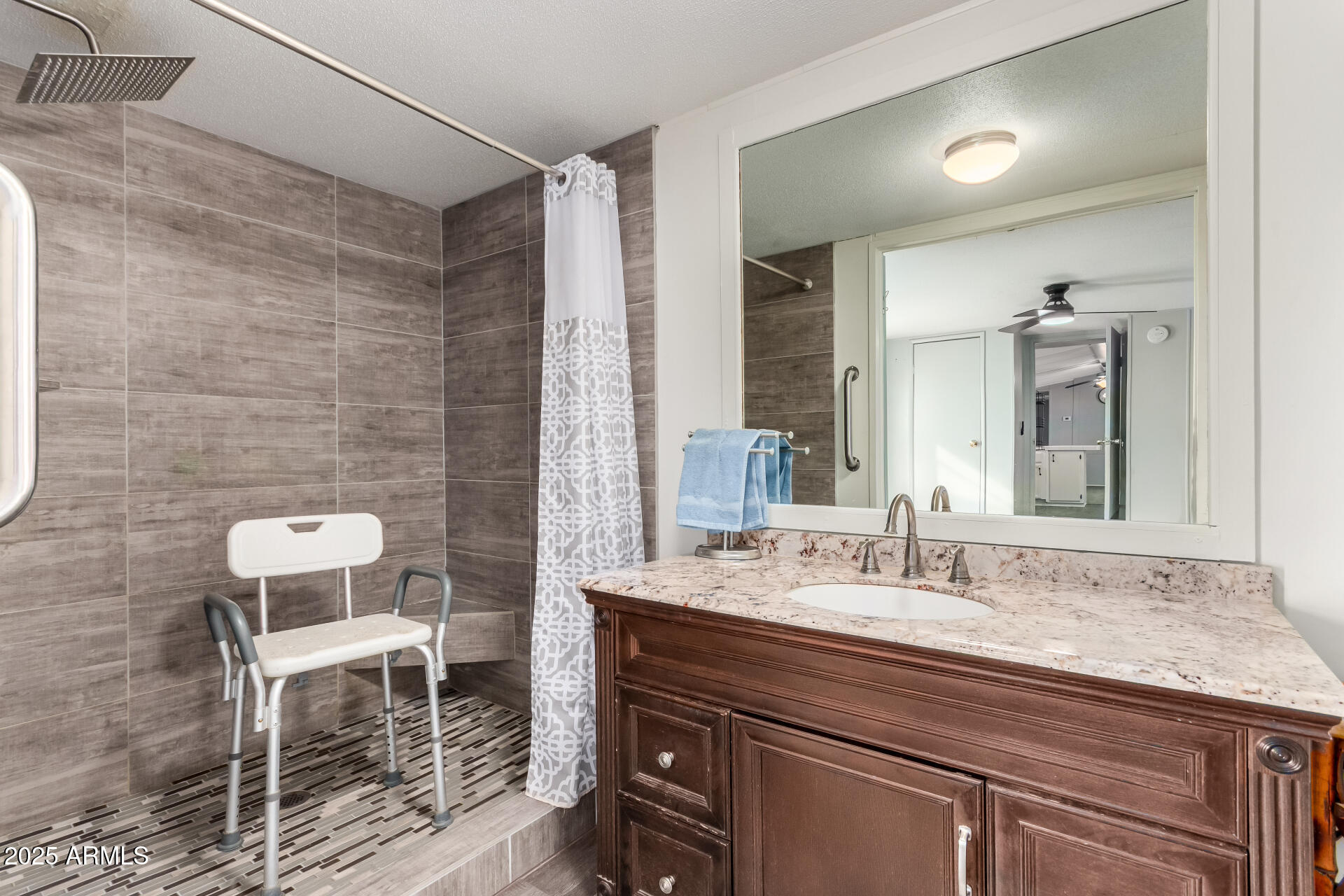 10401 North Cave Creek Road, Unit 93 Phoenix, AZ 85020 - Photo 16 of 28 a bathroom with a sink and a mirror