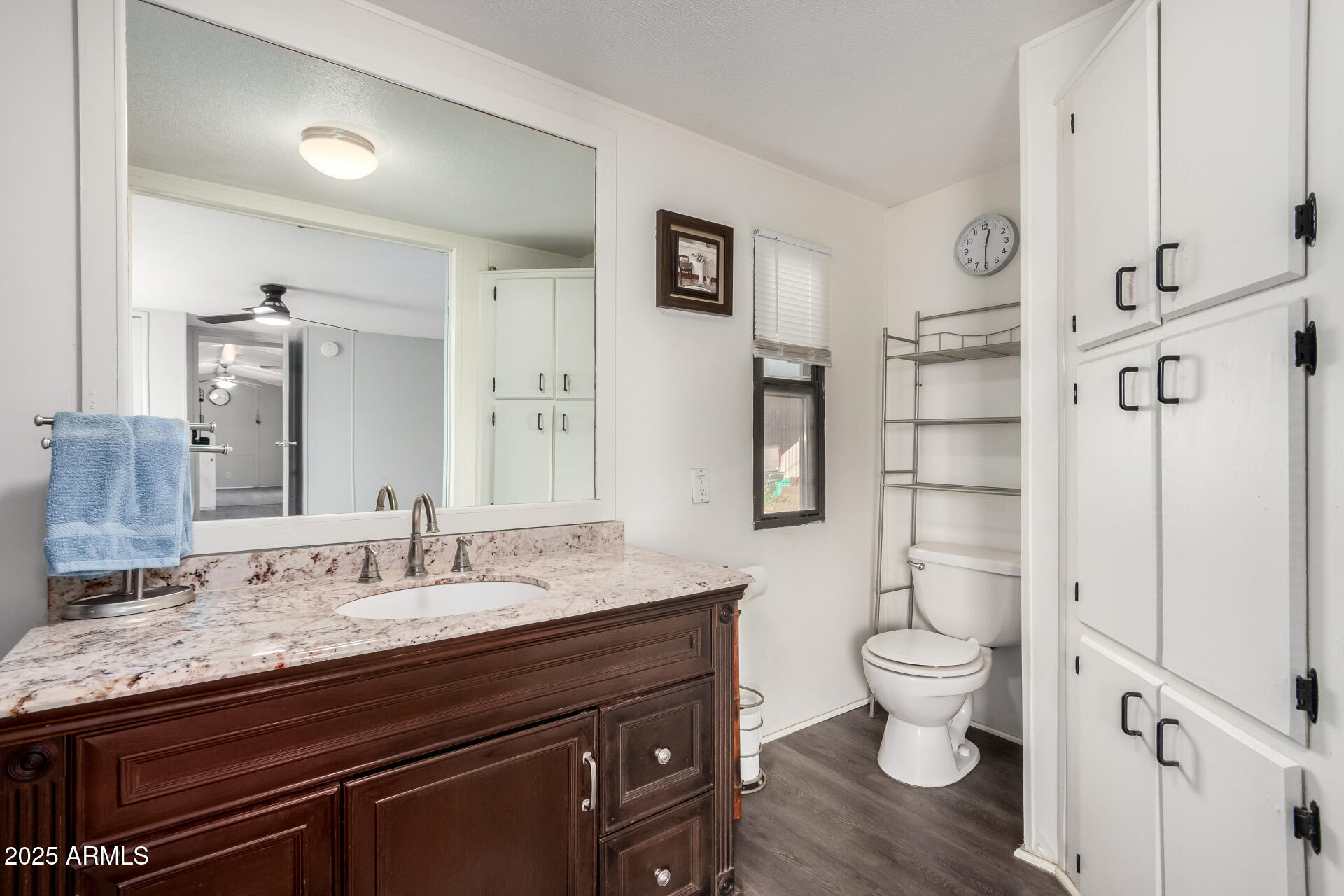 10401 North Cave Creek Road, Unit 93 Phoenix, AZ 85020 - Photo 17 of 28 a bathroom with a granite countertop sink a toilet and a shower
