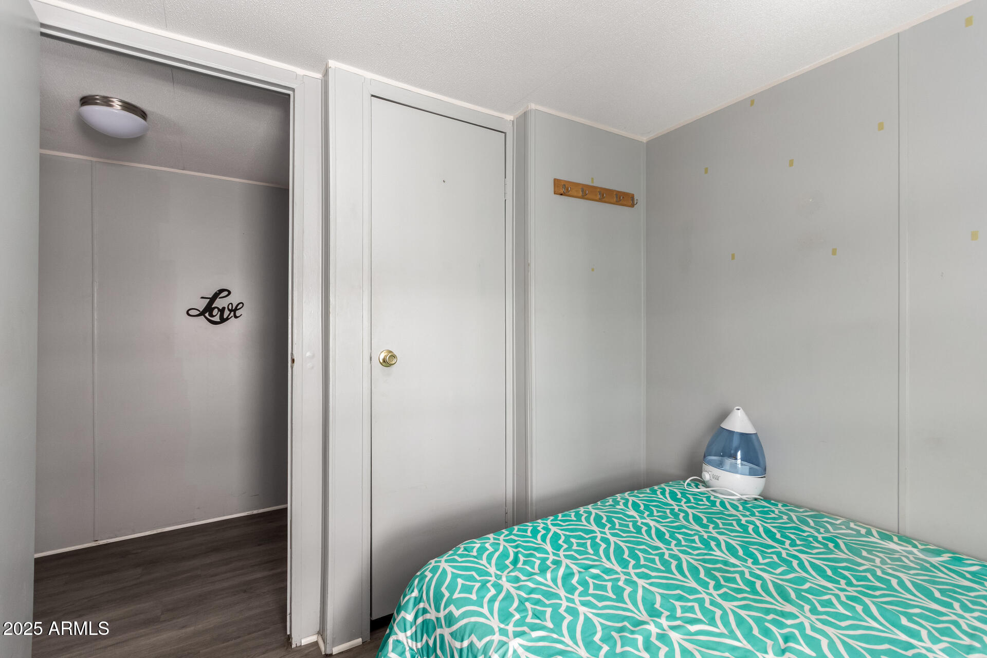 10401 North Cave Creek Road, Unit 93 Phoenix, AZ 85020 - Photo 21 of 28 a bedroom with a bed and a window