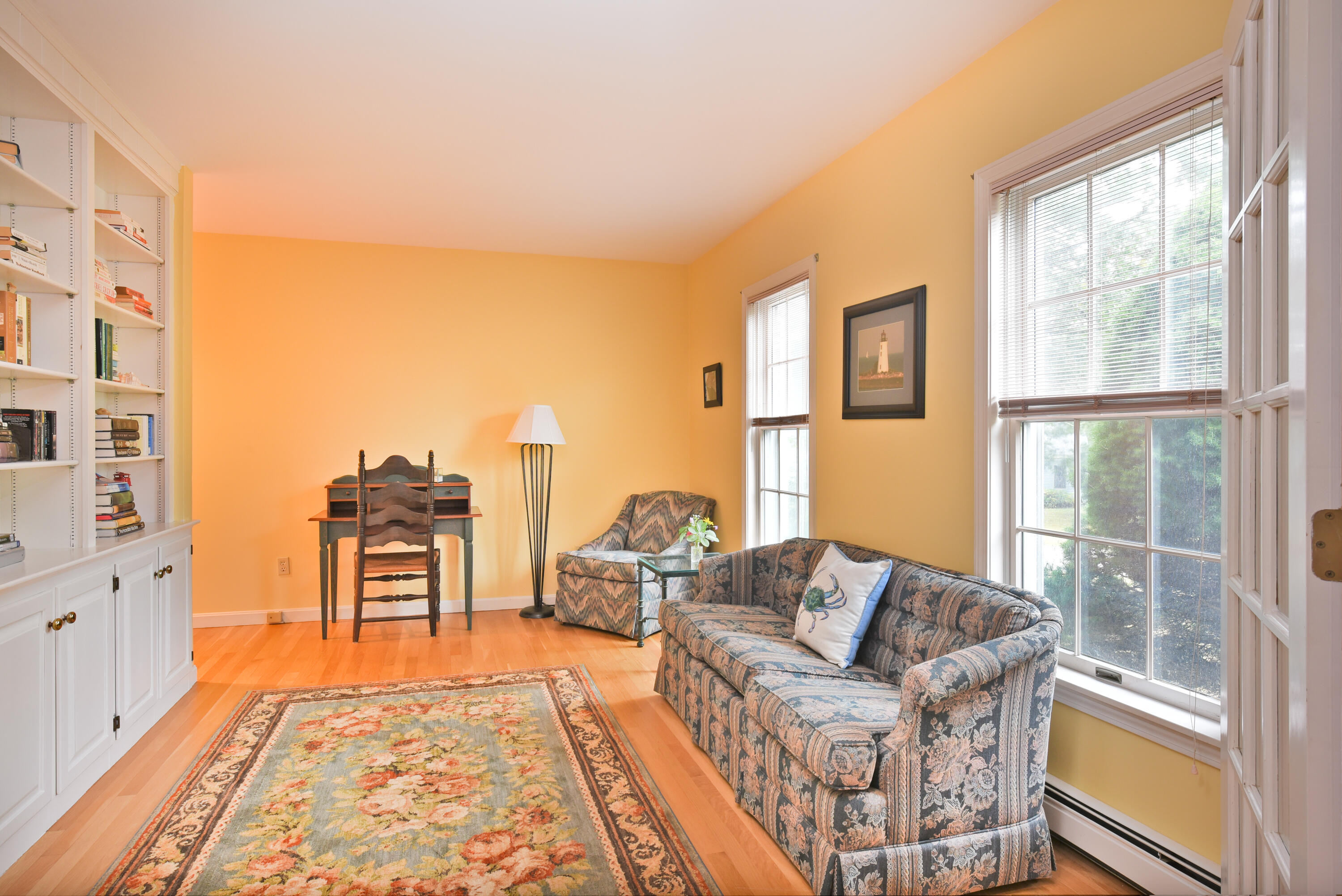 7 Captain Scott Road Harwich, MA 02645 - Photo 14 of 41 a living room with furniture and a floor to ceiling window