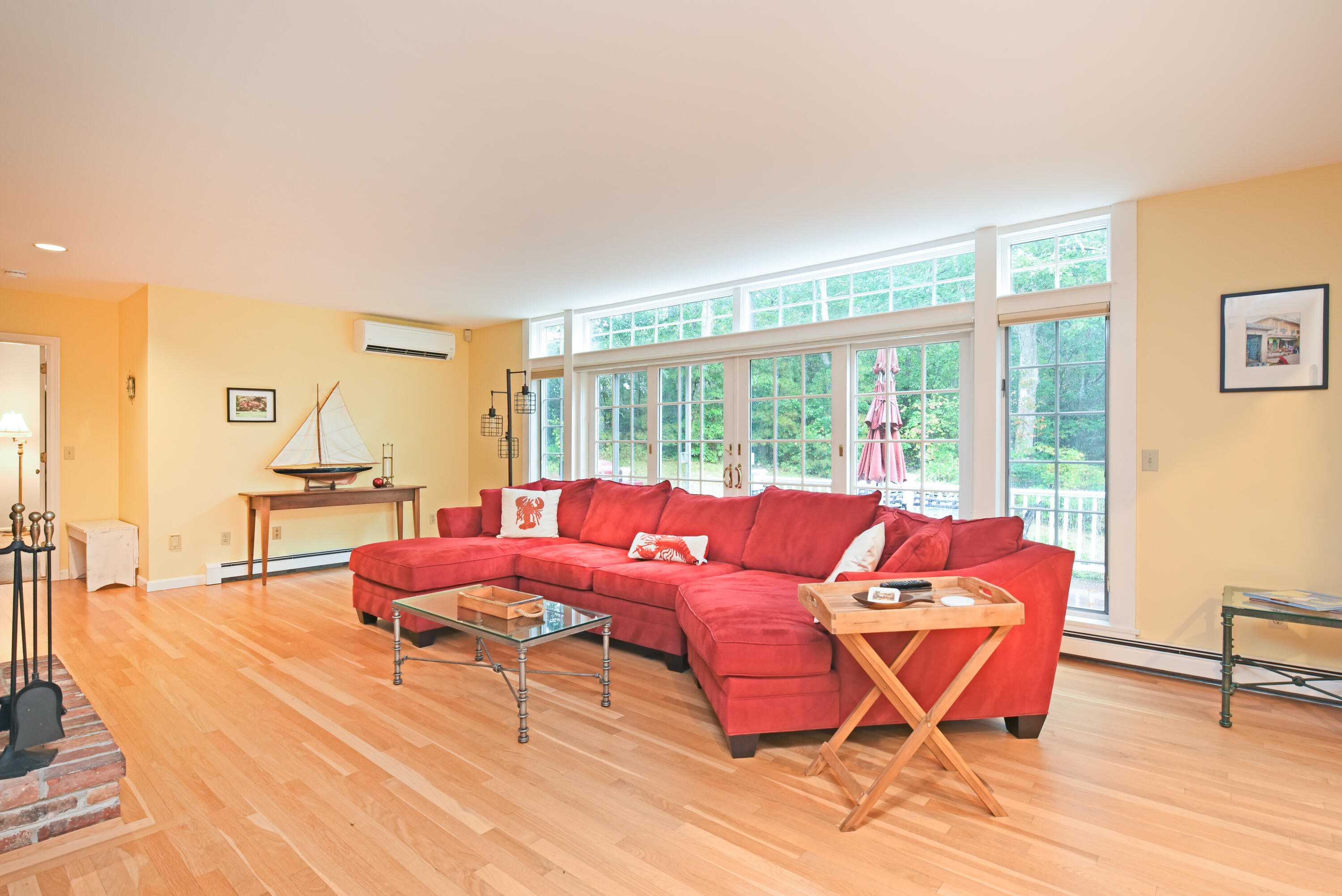 7 Captain Scott Road Harwich, MA 02645 - Photo 18 of 41 a living room with furniture and a floor to ceiling window