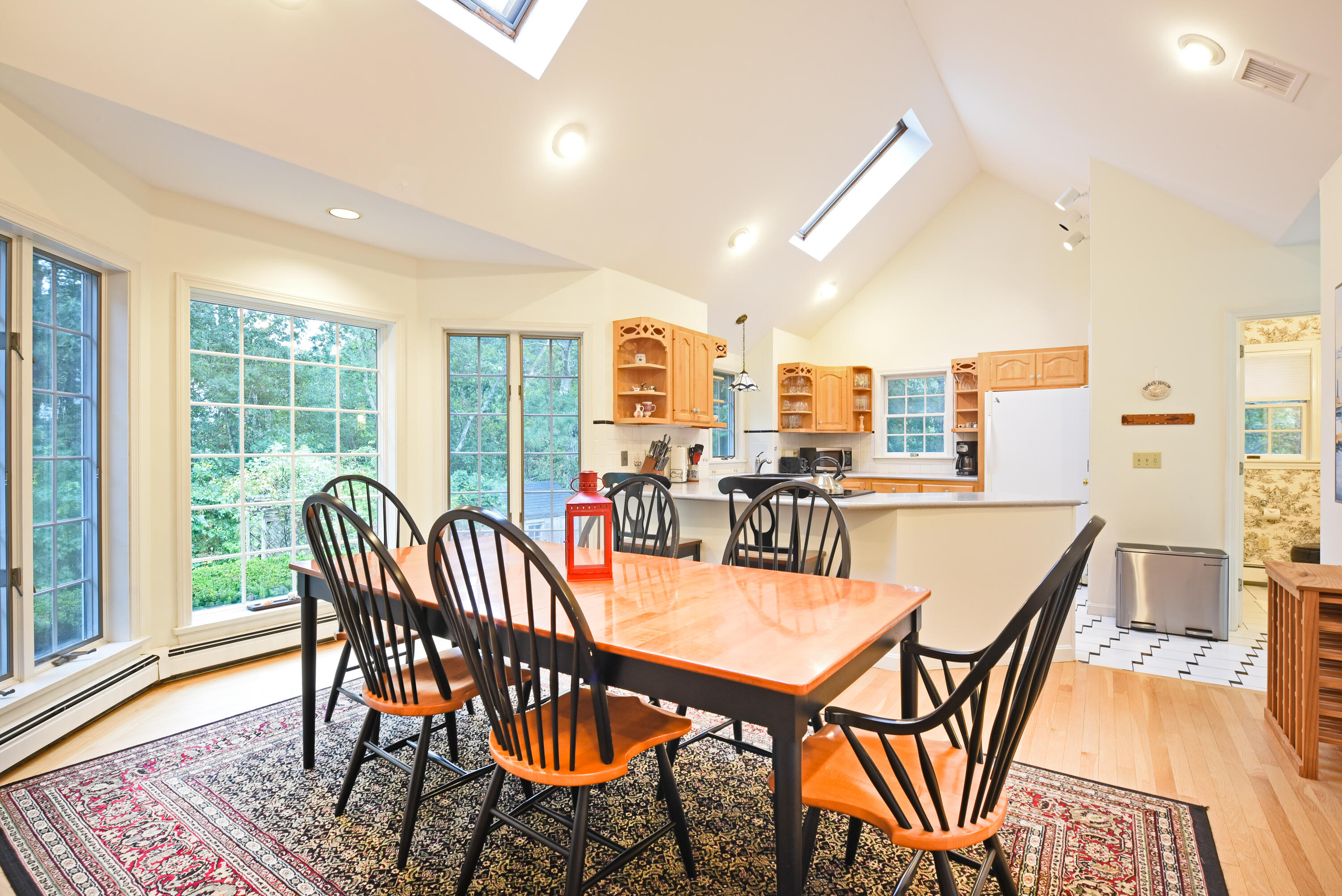 7 Captain Scott Road Harwich, MA 02645 - Photo 20 of 41 a dining room with furniture a rug and wooden floor